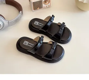 Detailed top view of black toddler slide sandals featuring stylish cute double bows