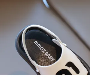 Macro shot of children sandals featuring soft leather heel strap and ningZ BABY logo