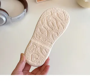 Detail of toddler slippers non-slip rubber sole with wave pattern and size 28 marking