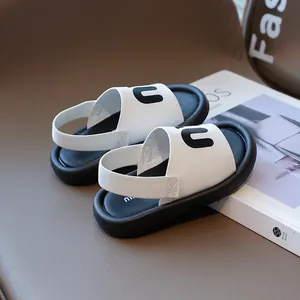 Kids black and white leather sandals with adjustable backstrap and letter n design