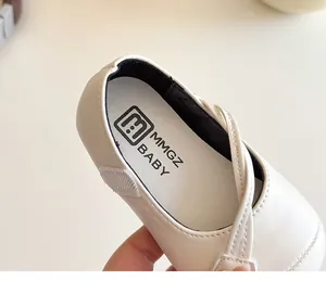 Detail view of the soft leather lining and branded cushioned insole of the kids' flat shoes