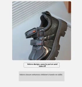 Detail of children's black patent leather shoes with convenient double hook and loop straps
