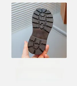 Close-up of size 26 non-slip rubber sole with deep tread pattern for kids shoes