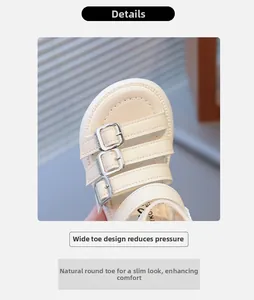 Detailed close-up of girls beige sandals featuring wide round toe and metal buckles