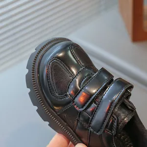 Classic black British style kids loafers with dual hook-and-loop straps for boys and girls