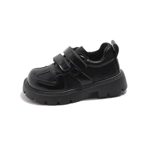 Classic black leather kids' school shoes with double hook and loop straps and non-slip sole