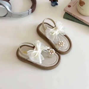 Mädchen-Sandalen in Beige mit großer Organza-Schleife und edlen Perlen-Applikationen