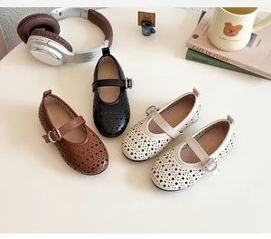 Detailed overhead view of hollow-out Mary Jane shoes in brown, black and beige colors