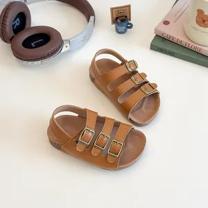 Sandales Birkenstock marron pour enfants avec semelle en liège et boucles en bronze réglables