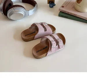Detail view of pink girls' double-strap cork sandals with silver buckles and soft suede