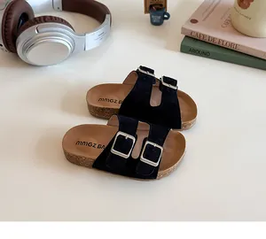 Detail view of children's black double buckle cork sandals with soft suede-like texture