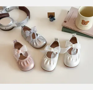 Three colors of girls' shiny Mary Jane shoes featuring delicate mesh bow decorations
