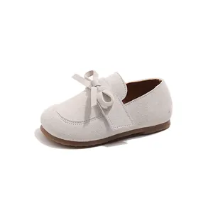Minimalist beige girls' princess shoes with bow detail and soft suede-like finish