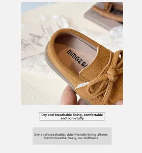 Detail of soft breathable inner lining and leather bow on brown kids' flats
