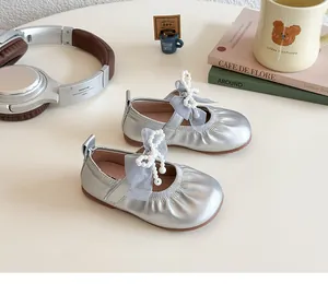 Silver Mary Jane shoes for girls featuring a mesh pearl bow and elegant flat soles