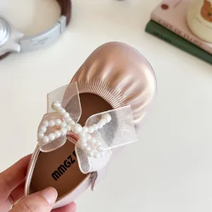 Pink gold Mary Jane girls shoes with pearl mesh bow and shiny metallic finish