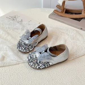 Sparkly silver sequin Mary Jane shoes for girls with lace bow and rhinestone detail