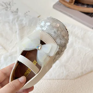 Girls cream Mary Jane shoes with silver sequins and large organza bow detail