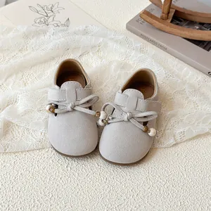 Retro girls' bow tie loafers in beige suede with wooden beads and velcro straps