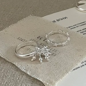 Elegant silver fireworks flower ring set with sphere charms and clover hollow engraving