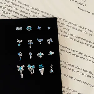 16-piece silver screw-back stud earring set with blue zircon bows and beach motifs