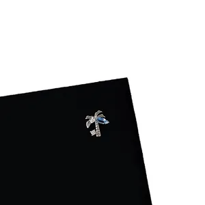 Minimalist silver coconut tree screw stud earring with blue and white zircon stones