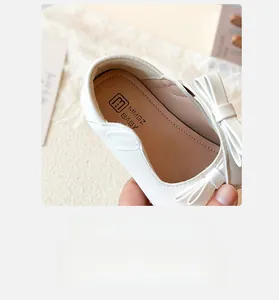 Detail of baby girl princess shoe featuring a soft bow on heel and premium leather lining