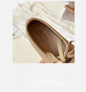 Detailed macro view of girls' brown leather Mary Jane shoes with soft breathable lining