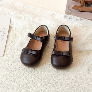 Classic dark brown girls Mary Jane shoes with double bow detail and soft sole