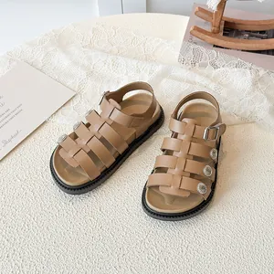 Brown retro Roman sandals for girls with woven straps and vintage silver stud details