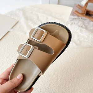 Brown children's double buckle faux leather sandals with ergonomic soles and black rubber grips