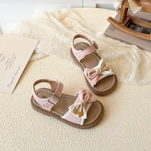 Pink and white patchwork girls princess sandals with bow decoration and ankle strap