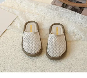 Detail shot of girls crochet hollow mesh sandals with thick brown sole and brand logo