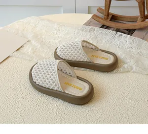 Detailed view of hollow out princess style toddler sandals with breathable mesh on lace background