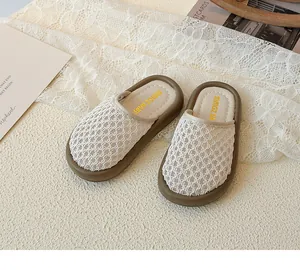 Detailed top view of kids princess lace hollow slippers on a warm decorative background