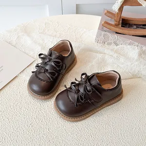 Chaussures Mary Jane marron foncé pour filles avec double nœud et découpes