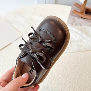 Chaussures vintage en cuir marron pour filles avec double nœud et perforations