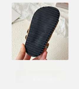 Detailed view of the anti-slip black rubber sole with size marking for children's sandals