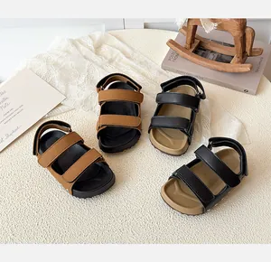 Detailed view of kids' open-toe sandals with non-slip soles and velcro straps
