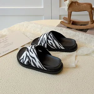 Kids zebra print cross strap slides with soft sole and stylish black and white stripes