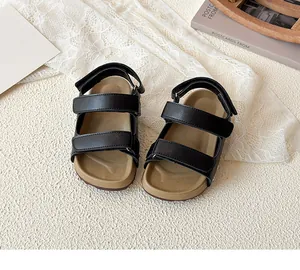 Detail of children's sandals with double adjustable hook-and-loop straps and ergonomic footbed