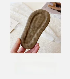 Close-up of non-slip rubber sole for children sandals featuring wavy anti-grip textures