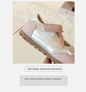 Detail of girls' velcro strap sneakers featuring pink accents and breathable mesh fabric