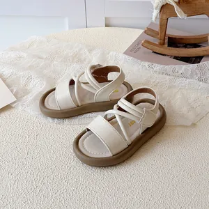 Chic girls' beige platform sandals with stylish crisscross straps and durable thick soles