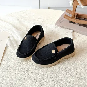 British style kids loafers with soft soles in black suede featuring a gold metal buckle