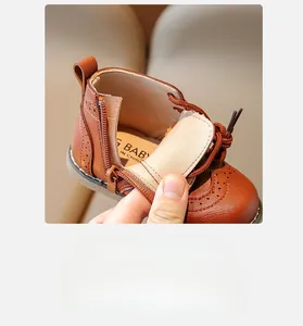 Close-up of brown children's leather boots showing soft lining and side zipper detail