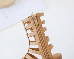 Detail shot of the back zipper closure on khaki gladiator sandals for girls