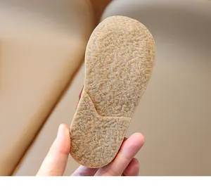 Close-up of durable non-slip rubber sole with size 24 marking on kids martin boots