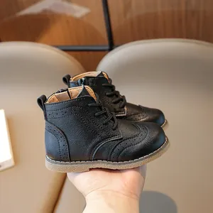 Classic black kids Brogue boots with textured leather and side zipper for easy wear