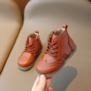 Classic dark red leather children's boots with Brogue details and side zipper closure